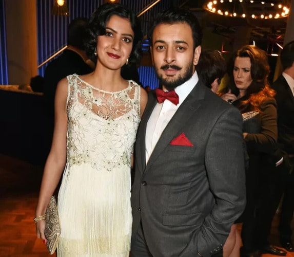 Rakhee Thakrar and her husband Vikash Bhai posing during party 